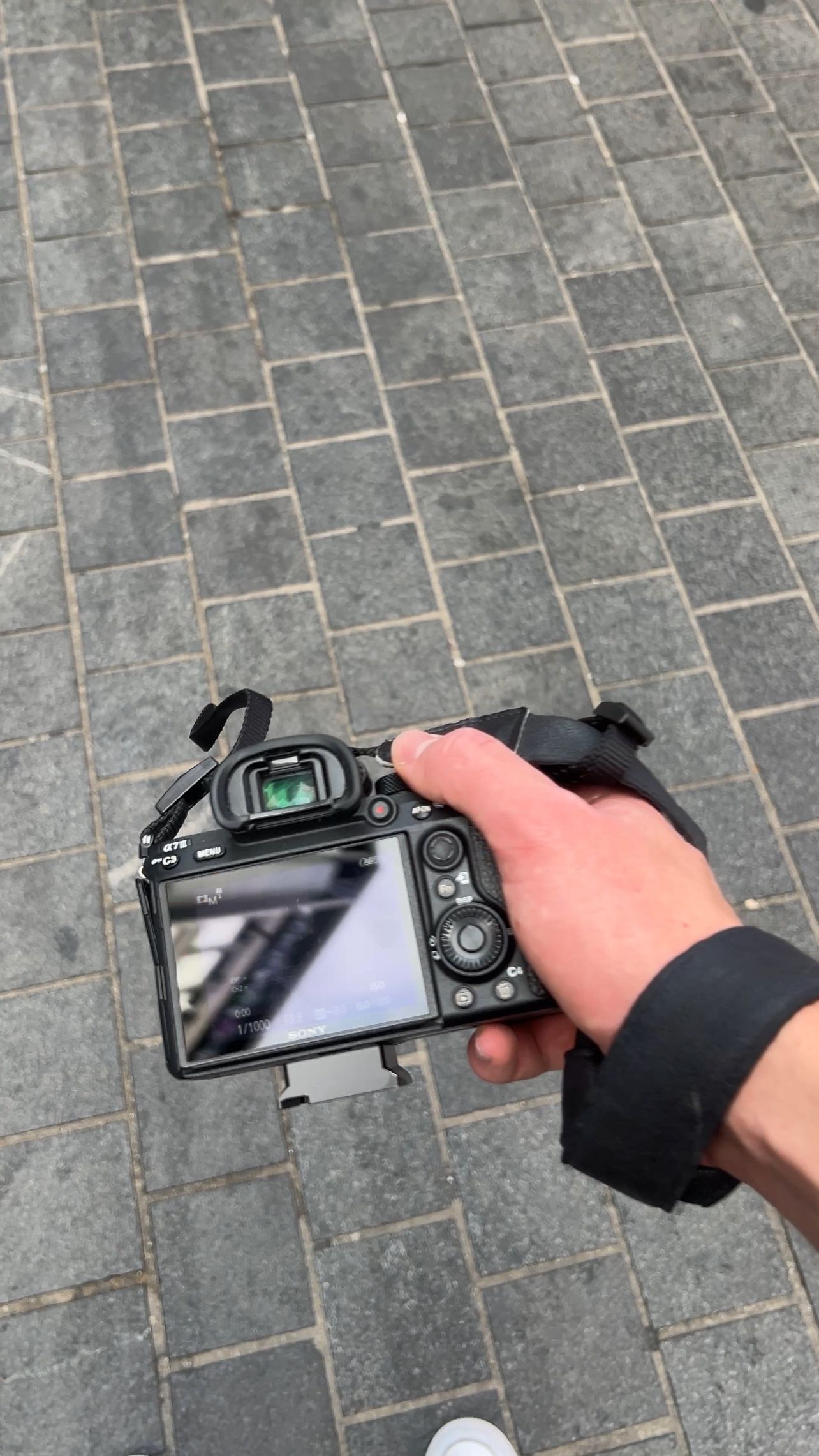 Sony camera in hand on a shoot